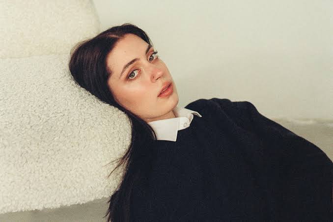 Lizzy McAlpine in a still from the official music video for "The Light in the Painting."